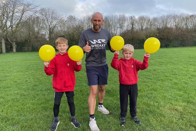 Asfordby Captain's Close Primary School deputy headteacher Liam Collins with pupils Jake and Freddie
