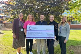 Handing over the cheque to Cancer Research UK