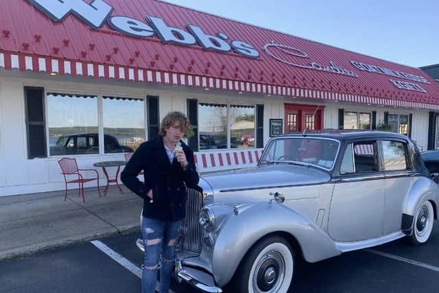 Comac Boylan stops off for ice cream while driving an old Bentley on his American trip
