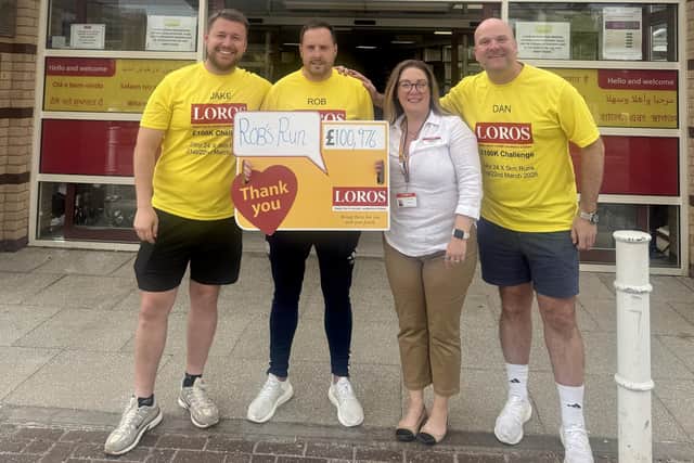 LOROS CEO, Camilla Barrow, receives with a cheque from fundraising friends Jake, Rob and Dan