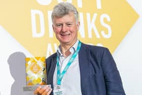 Belvoir Farm owner, Pev Manners with the award for Best Dilutable Drink award given for the firm's Elderflower Cordial