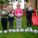 Youngsters at Melton's Little Rascals Day Nurseries enjoy playing with their new mini footballs donated by Barratts