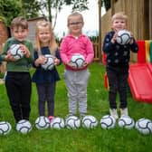 Youngsters at Melton's Little Rascals Day Nurseries enjoy playing with their new mini footballs donated by Barratts