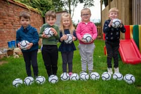Youngsters at Melton's Little Rascals Day Nurseries enjoy playing with their new mini footballs donated by Barratts