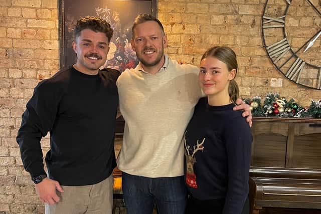 The family which owns Melton's Kitchen and Coffee cafe, from left, Henry Young-Alls, his father Matt and sister Neev