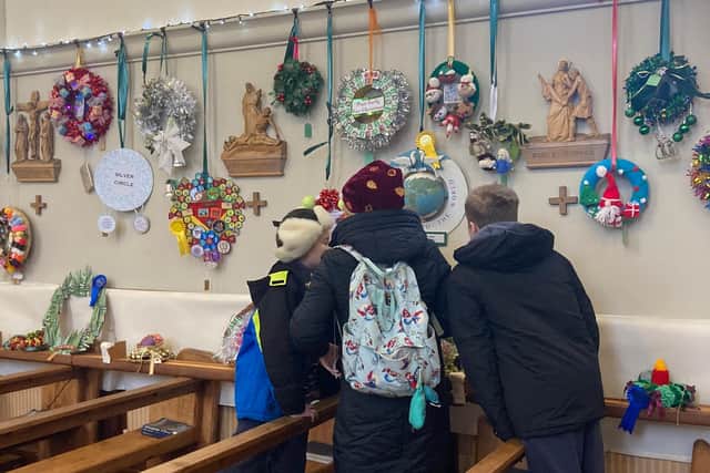 Visitors enjoying a tour of last year's annual Melton Christmas wreaths festival at St John's Catholic Church