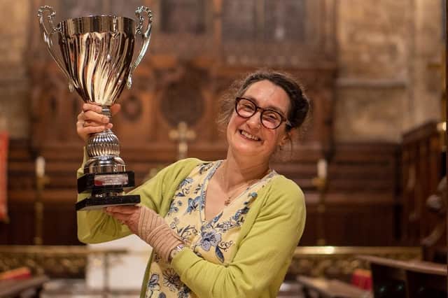 Gillian Clough lifts the Supreme Champion trophy for Tenacres Cheese dairy (Hebden Bridge) at the Artisan Cheese Awards in Melton