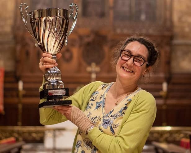 Gillian Clough lifts the Supreme Champion trophy for Tenacres Cheese dairy (Hebden Bridge) at the Artisan Cheese Awards in Melton