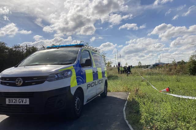 Police officers at the glider crash site in Melton this afternoon