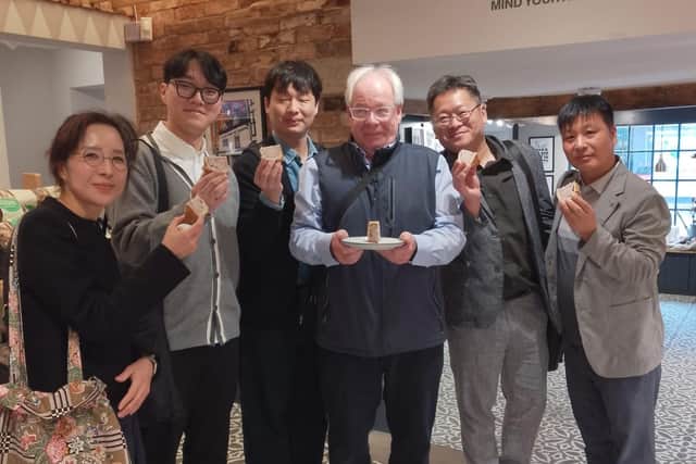 Matthew O'Callaghan with the delegation of Korean food officials at Ye Olde Pork Pie Shoppe in Melton