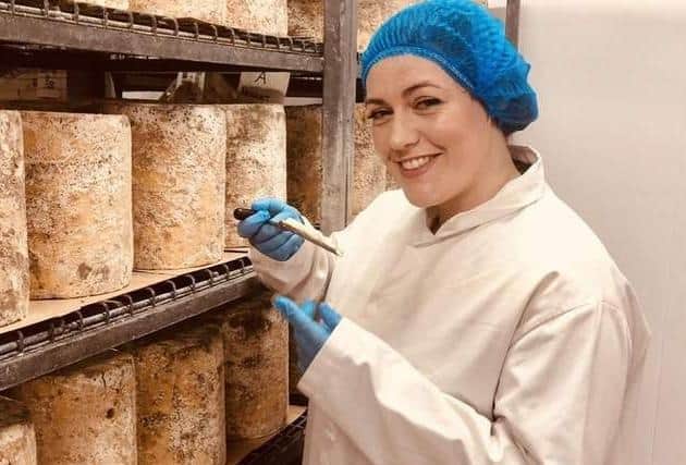 Melton MP, Alicia Kearns, founder and chairof the All-Party Parliamentary Group on Geographically Protected Food and Drink, pictured with Stilton cheese on a visit to Long Clawson Dairy