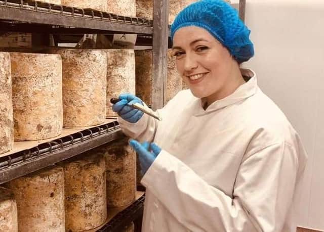 Melton MP, Alicia Kearns, founder and chairof  the All-Party Parliamentary Group on Geographically Protected Food and Drink, pictured with Stilton cheese on a visit to Long Clawson Dairy