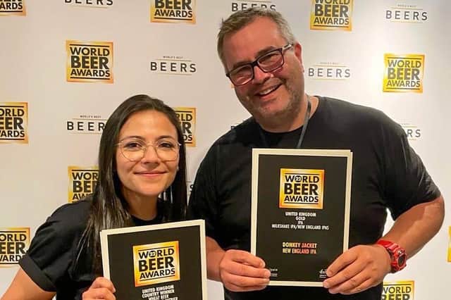 Lara Lopes and Colin Paige show off the World Beer Awards medals won by Melton's Round Corner Brewing