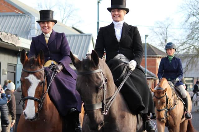 Women riding side saddle with the Belvoir Hunt
