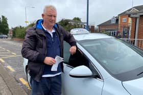 Melton taxi driver Darryl Robson with his vehicle parked on the Wilton Road rank