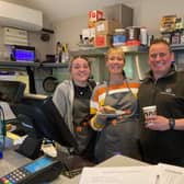 Owner Adam Davies and Louise Rigley in the shop and cafe at Stathern Garage with staff member Megan Gray (left)