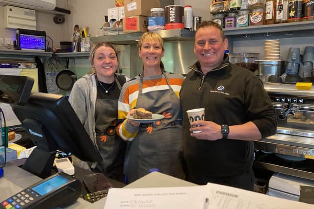 Owner Adam Davies and Louise Rigley in the shop and cafe at Stathern Garage with staff member Megan Gray (left)