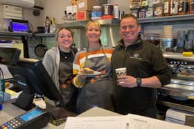 Owner Adam Davies and Louise Rigley in the shop and cafe at Stathern Garage with staff member Megan Gray (left)
