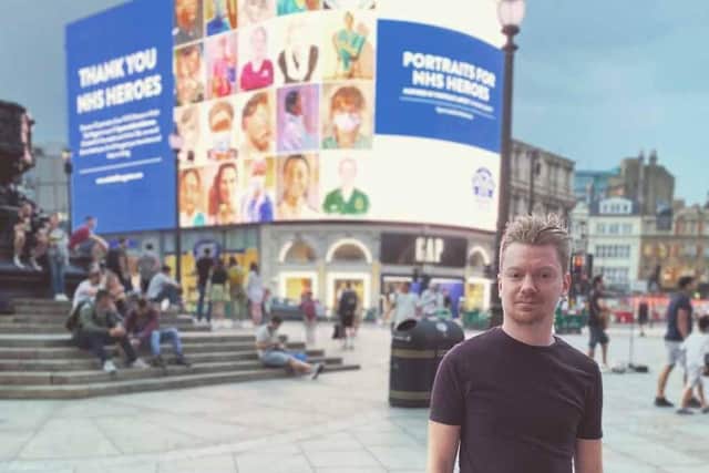 Grant Milne pictured in 2020 in London's Piccadilly in front of his previous artwork display