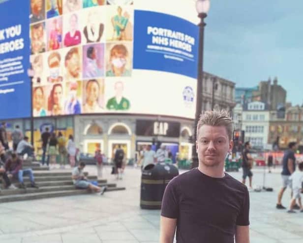 Grant Milne pictured in 2020 in London's Piccadilly in front of his previous artwork display