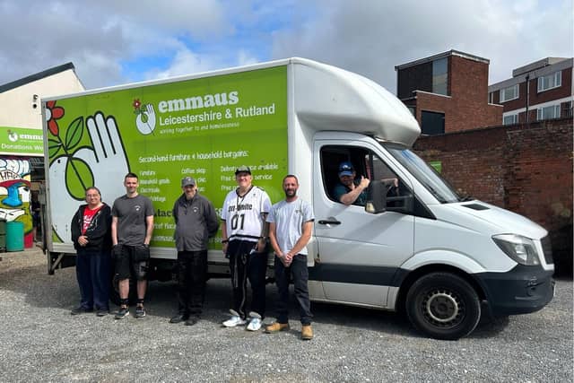 Steve (quoted) in the driving seat, with some of the Emmaus team with their existing van, outside the Emporium shop