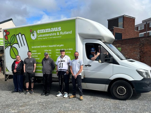 Steve (quoted) in the driving seat, with some of the Emmaus team with their existing van, outside the Emporium shop