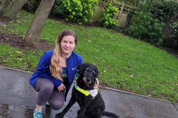 Amanda Woodford with a guide dog