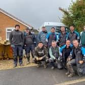 The volunteers provided by WellChild and British Gas, pictured outside the Hayden family home at Asfordby