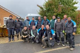 The volunteers provided by WellChild and British Gas, pictured outside the Hayden family home at Asfordby