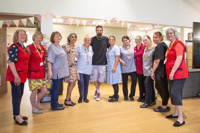 Kasabian singer Serge Pizzorno with nurses and volunteers at LOROS Hospice ahead of this month's Stomp Round Leicester art trail fundraiser
