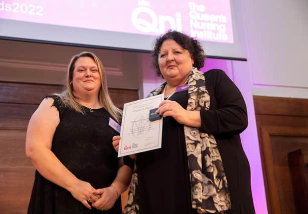 Donna Fraser (left) receivers her Queen’s Nurse certificate from Deborah Sturdy, the chief nurse for adult social care. 
Photo by Kate Stanworth