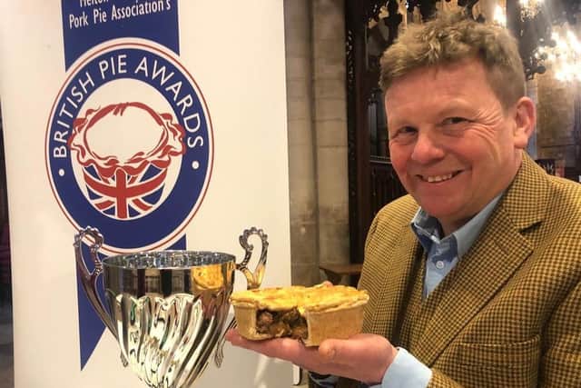 Piemaker Ian Jalland celebrates after Brockleby's Pies wins the Supreme Champion title at the British Pie Awards 2023 with their Moo and Blue pie