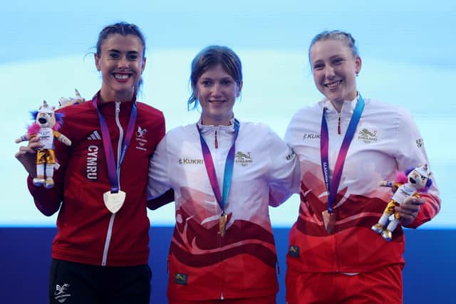 Gold medalist Sophie Hahn of Team England (C), Silver medalist Olivia Breen of Team Wales and Bronze medalist Maddie Down of Team England pose for a photo during the medal ceremony for the Women's 100 Metres T38 Final (Photo by Paul Harding/Getty Images)
