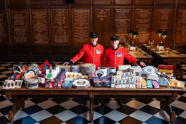 Chelsea Pensioners Eddie Russell and Michael Gue with the cheese donations to this years Annual Ceremony of the Christmas Cheeses