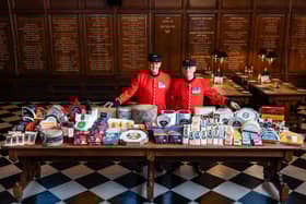 Chelsea Pensioners Eddie Russell and Michael Gue with the cheese donations to this years Annual Ceremony of the Christmas Cheeses