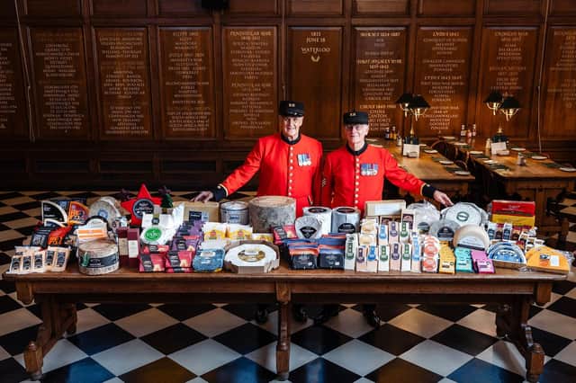 Chelsea Pensioners Eddie Russell and Michael Gue with the cheese donations to this years Annual Ceremony of the Christmas Cheeses