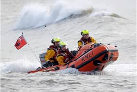 An RNLI crew on a mission in rough seas on the UK coast