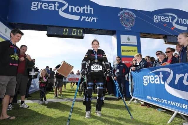 Claire Lomas crosses the finish line in her robotic suit at the Great North Run in 2016