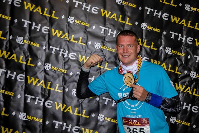 Anthony Ison with his medal for completing The Wall ultra marathon