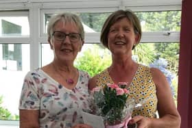Ladies President Liz Snow presents overall winner Kate Britton with her trophy and prize.