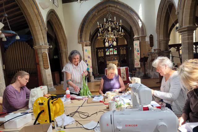 Ladies at Waltham Church sewing bunting for the Platinum Jubilee