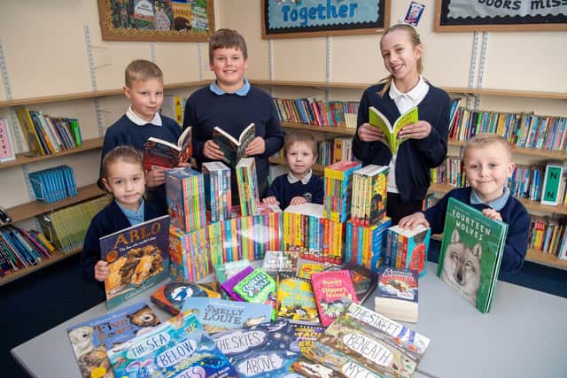 Swallowdale Primary School pupils look through some of their new books