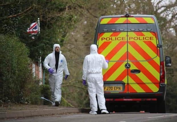 Forensics officers at the scene of the murder at Colston Bassett 
PHOTO GEORGE ICKE
