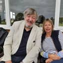 Comedy actor and MCC president, Stephen Fry, watches the game with Kate Bygott, secretary of Belvoir Cricket Club and a trustee of the Belvoir Cricket & Countryside Trust