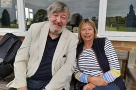 Comedy actor and MCC president, Stephen Fry, watches the game with Kate Bygott, secretary of Belvoir Cricket Club and a trustee of the Belvoir Cricket & Countryside Trust