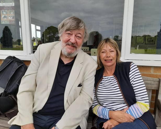 Comedy actor and MCC president, Stephen Fry, watches the game with Kate Bygott, secretary of Belvoir Cricket Club and a trustee of the Belvoir Cricket & Countryside Trust