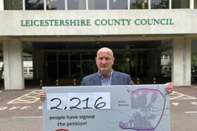 Melton Borough Council leader Joe Orson pictured at County Hall in June last year delivering a petition supporting funding for a southern link to the approved MMDR