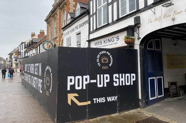 The boarded up frontage of Ye Olde Pork Pie Shoppe in Melton - the renovated store reopens next week