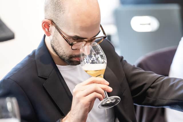One of the judges at European Beer ChallengeTM 2025 samples an ale