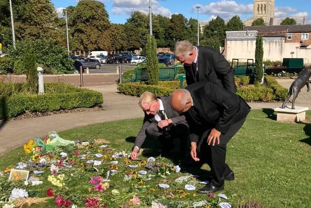 The King's county representative - the Lord Lieutenant of Leicestershire - visits Melton's floral tributes to The Queen, with the Mayor and the council's chief executive